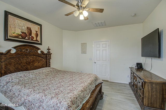 bedroom featuring light hardwood / wood-style floors and ceiling fan