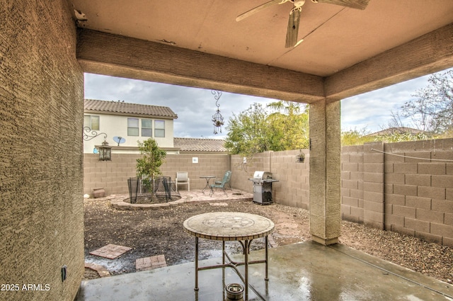 view of patio / terrace with ceiling fan and a grill