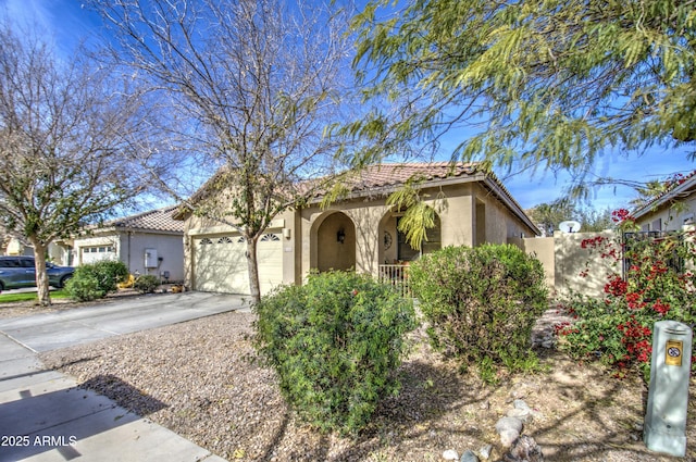 mediterranean / spanish-style home with a garage