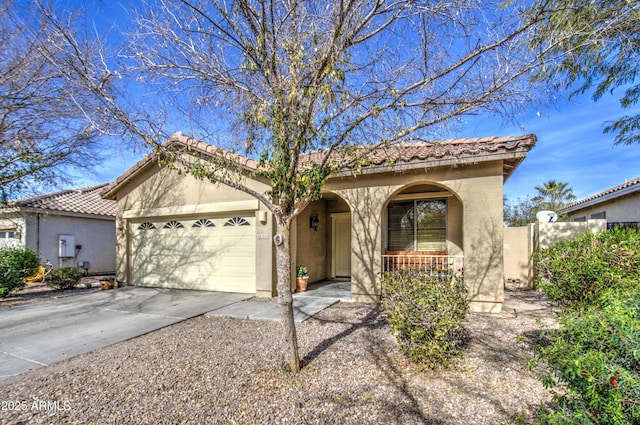 mediterranean / spanish house featuring a garage and a porch