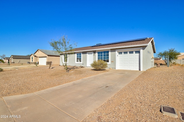 single story home featuring a garage