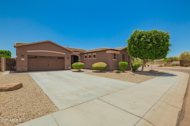 16259 W Papago St, Goodyear, AZ 85338 - view of front of home with stucco siding, an attached garage, and concrete driveway
