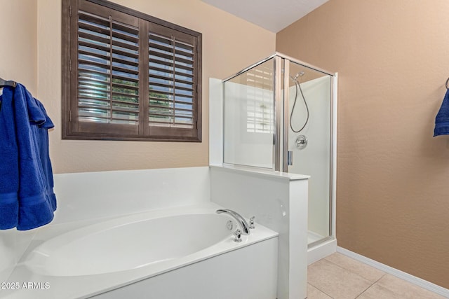 16259 W Papago St, Goodyear, AZ 85338 - bathroom featuring a shower stall, a garden tub, tile patterned flooring, and a textured wall