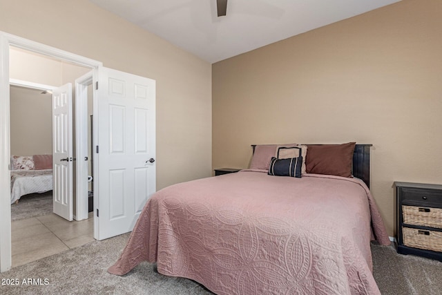 16259 W Papago St, Goodyear, AZ 85338 - carpeted bedroom with ceiling fan and tile patterned floors