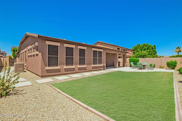 16259 W Papago St, Goodyear, AZ 85338 - rear view of property with stucco siding, a fenced backyard, and a patio