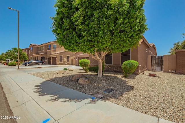 16259 W Papago St, Goodyear, AZ 85338 - view of front of property featuring stucco siding and a gate