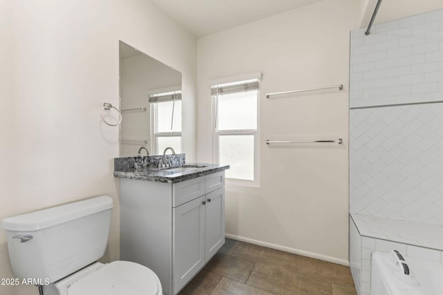 bathroom with vanity, toilet, and tile patterned flooring