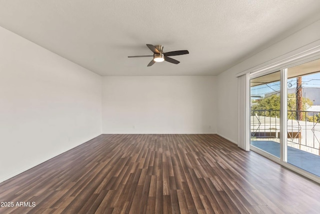 unfurnished room featuring dark wood-type flooring, ceiling fan, and a textured ceiling