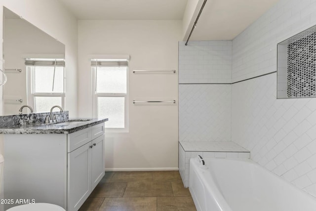 bathroom with vanity and a bathing tub