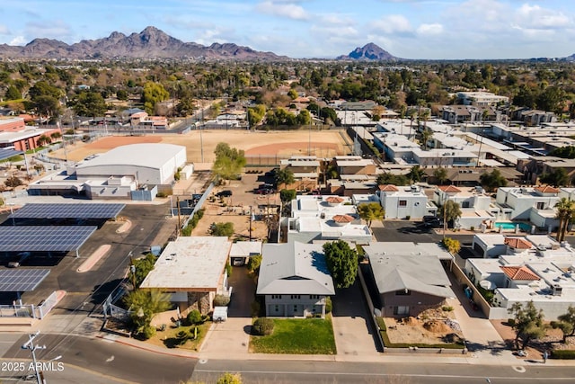 birds eye view of property with a mountain view