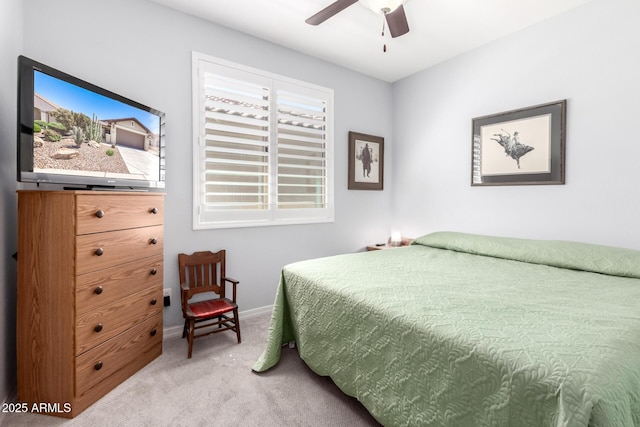 bedroom featuring carpet flooring, baseboards, and a ceiling fan