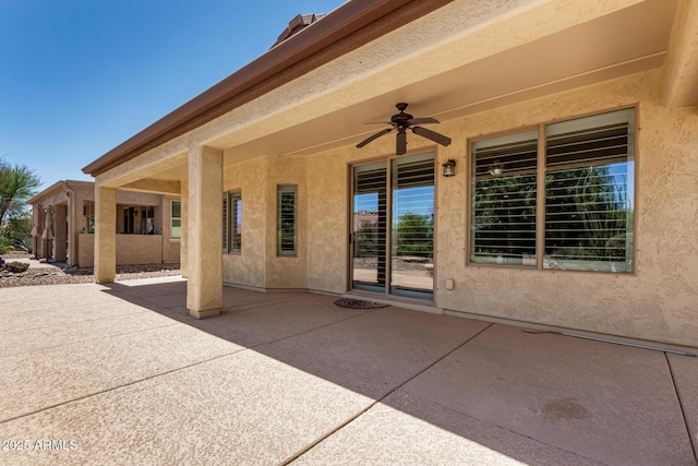 view of patio featuring ceiling fan