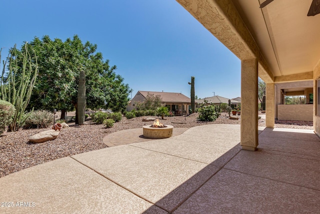 view of patio / terrace featuring an outdoor fire pit