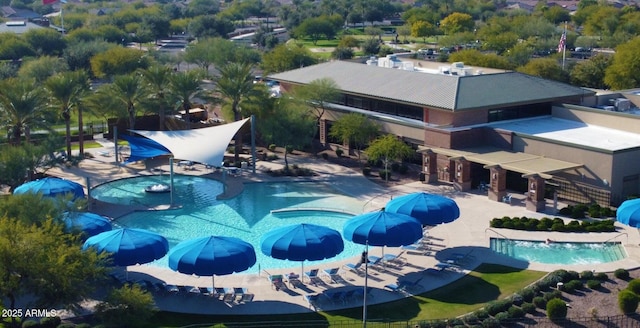 community pool featuring a patio area
