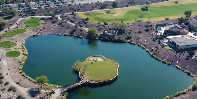 aerial view of property's location with a nearby body of water and a local golf course