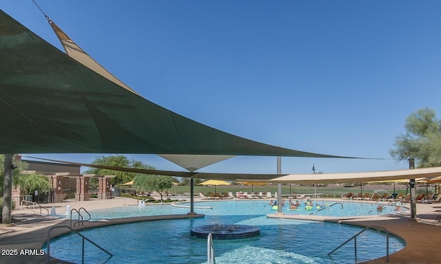 community pool with a patio area