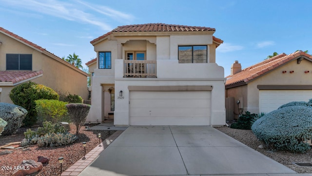 mediterranean / spanish-style home featuring a balcony and a garage