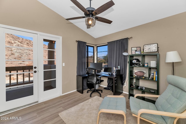 office featuring light hardwood / wood-style floors, ceiling fan, and lofted ceiling