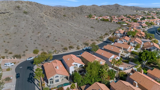 birds eye view of property with a mountain view