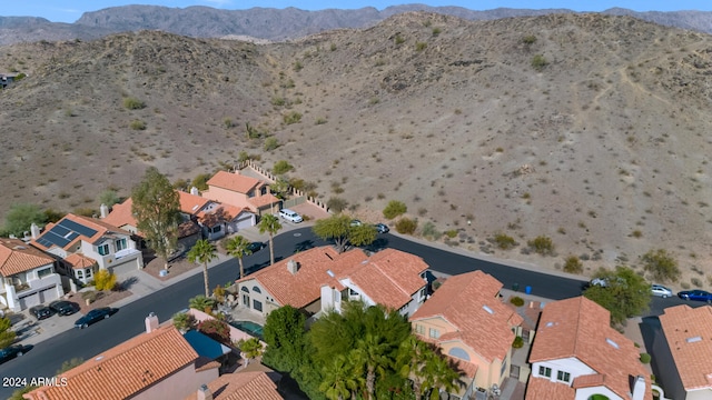 birds eye view of property with a mountain view