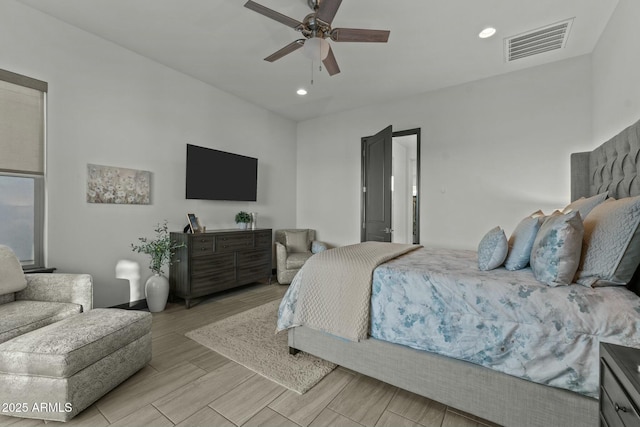 bedroom featuring ceiling fan, recessed lighting, visible vents, and wood tiled floor