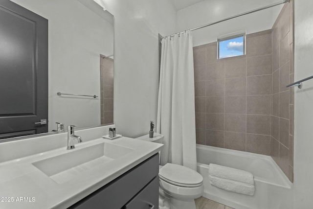 full bath with vanity, shower / tub combo, and toilet