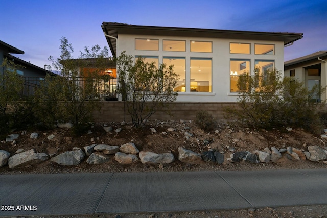 view of property exterior at dusk