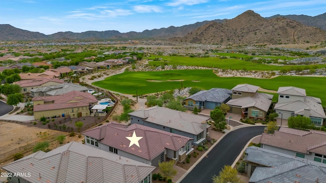 bird's eye view with view of golf course, a mountain view, and a residential view