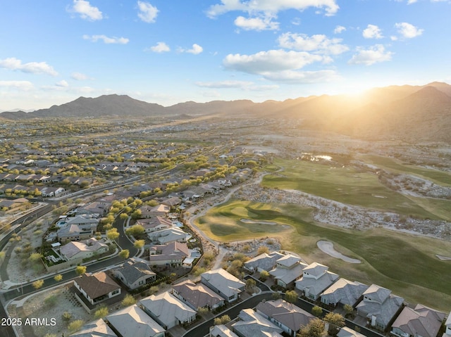 drone / aerial view featuring a mountain view, a residential view, and view of golf course