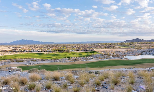 property view of mountains featuring a water view and view of golf course