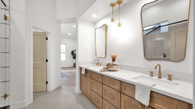 5103 E Juniper Ave, Scottsdale, AZ 85254 - bathroom featuring double vanity, recessed lighting, tile patterned flooring, and baseboards