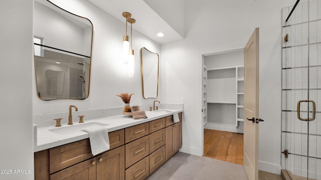 5103 E Juniper Ave, Scottsdale, AZ 85254 - full bath with a shower stall, double vanity, a walk in closet, tile patterned floors, and recessed lighting