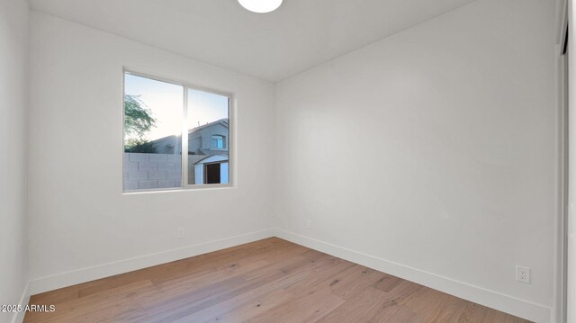 5103 E Juniper Ave, Scottsdale, AZ 85254 - unfurnished room with baseboards and light wood-style flooring
