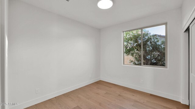 5103 E Juniper Ave, Scottsdale, AZ 85254 - empty room with baseboards and light wood-type flooring