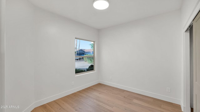 5103 E Juniper Ave, Scottsdale, AZ 85254 - unfurnished bedroom featuring light wood finished floors, baseboards, and a closet