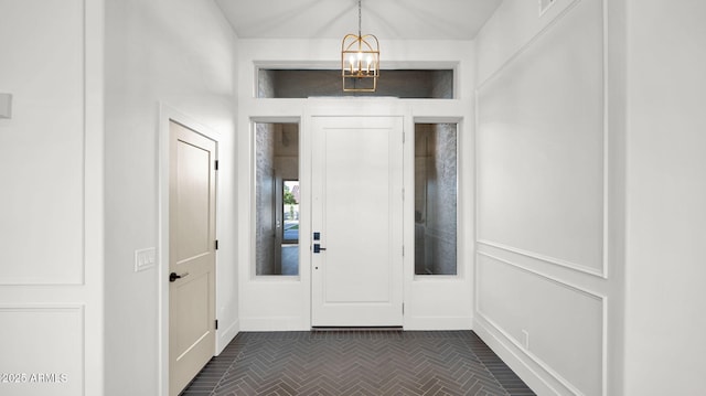 5103 E Juniper Ave, Scottsdale, AZ 85254 - foyer entrance with a chandelier, baseboards, and brick patterned flooring