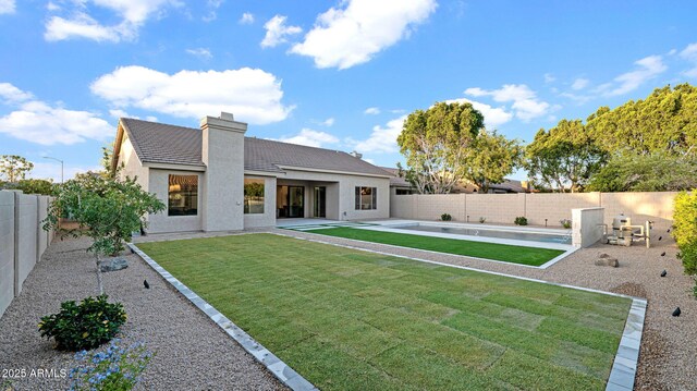 5103 E Juniper Ave, Scottsdale, AZ 85254 - rear view of house featuring stucco siding, a patio, a chimney, and a tiled roof