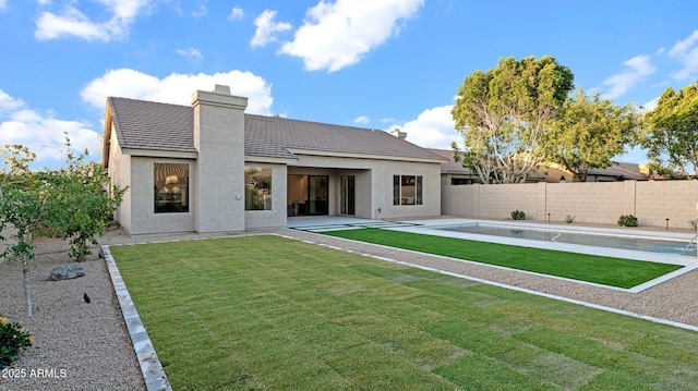 5103 E Juniper Ave, Scottsdale, AZ 85254 - rear view of property with stucco siding, a patio area, a chimney, and a tiled roof
