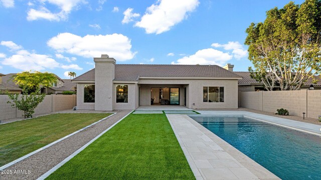 5103 E Juniper Ave, Scottsdale, AZ 85254 - back of house with a tiled roof, a chimney, stucco siding, and a patio area