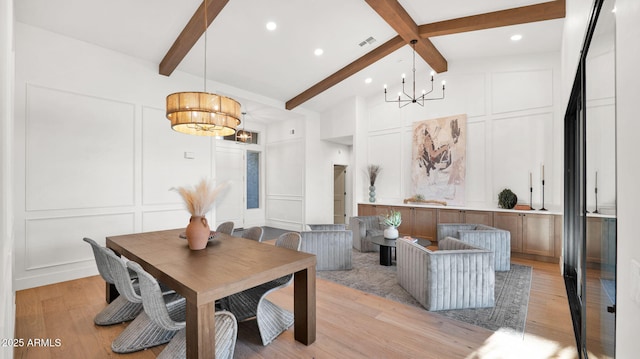 5103 E Juniper Ave, Scottsdale, AZ 85254 - dining area with a decorative wall, a chandelier, light wood finished floors, and recessed lighting