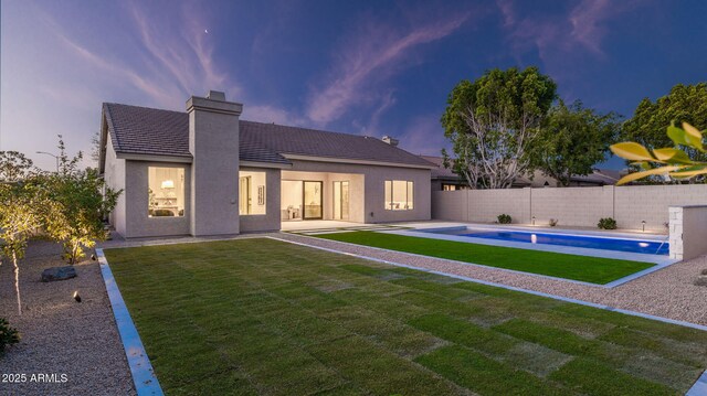 5103 E Juniper Ave, Scottsdale, AZ 85254 - back of house featuring a chimney, stucco siding, a patio, and a tile roof