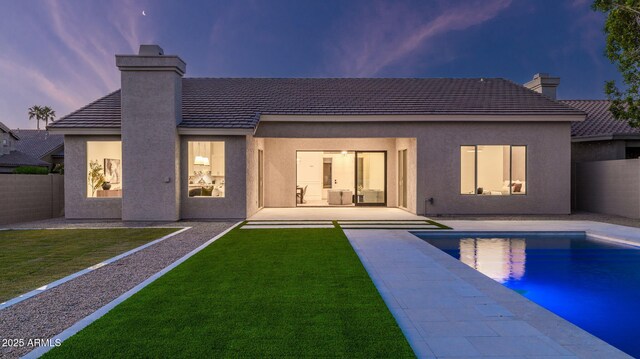 5103 E Juniper Ave, Scottsdale, AZ 85254 - rear view of house featuring a chimney, stucco siding, a patio, and a tiled roof