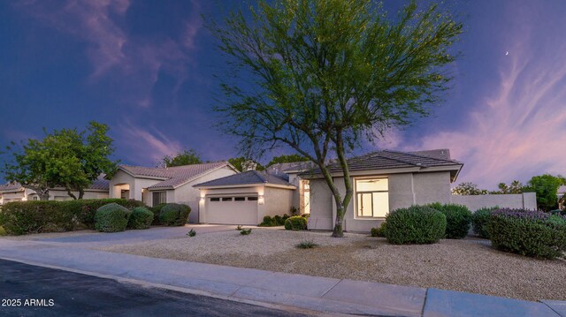 5103 E Juniper Ave, Scottsdale, AZ 85254 - single story home featuring stucco siding, a garage, a tiled roof, and driveway