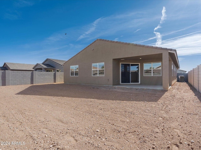 rear view of property featuring a patio area