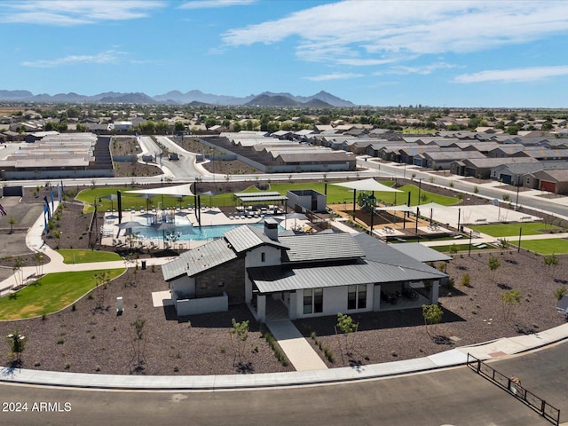 birds eye view of property with a mountain view