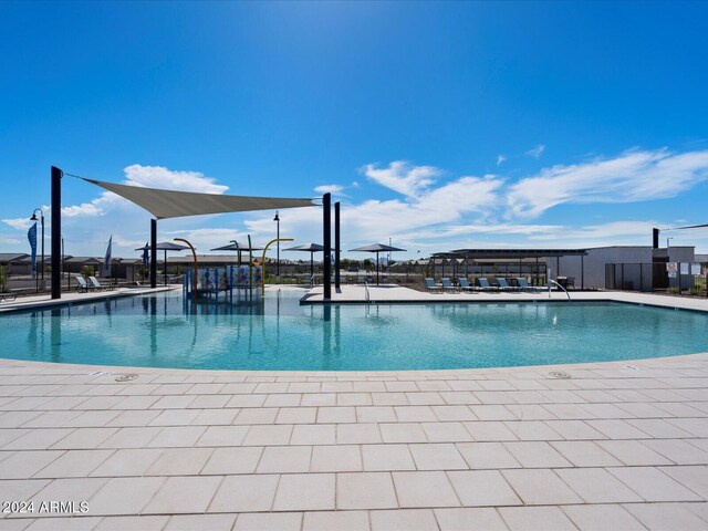 view of swimming pool with a patio area