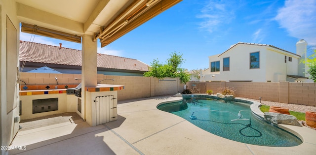 13614 N 12th Way, Phoenix, AZ 85022 - view of swimming pool with a fenced in pool, exterior kitchen, a patio, and a fenced backyard