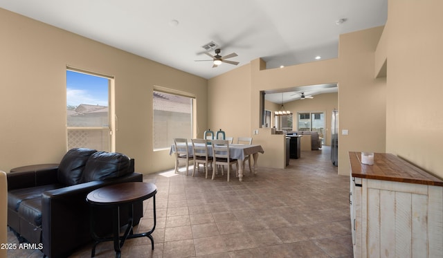 13614 N 12th Way, Phoenix, AZ 85022 - dining room featuring a ceiling fan, visible vents, stone finish floor, and lofted ceiling