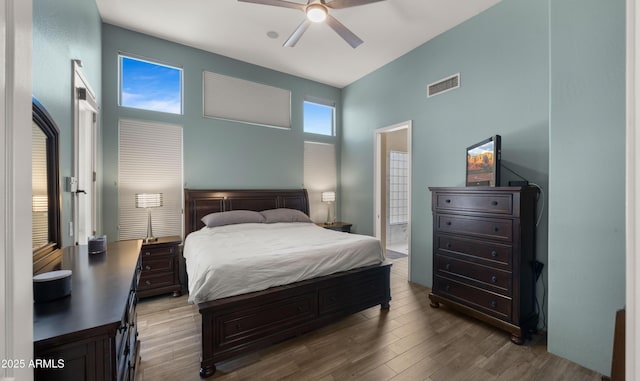 13614 N 12th Way, Phoenix, AZ 85022 - bedroom featuring a towering ceiling, visible vents, wood finished floors, and a ceiling fan
