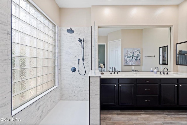 13614 N 12th Way, Phoenix, AZ 85022 - bathroom featuring wood finish floors, walk in shower, double vanity, and a sink